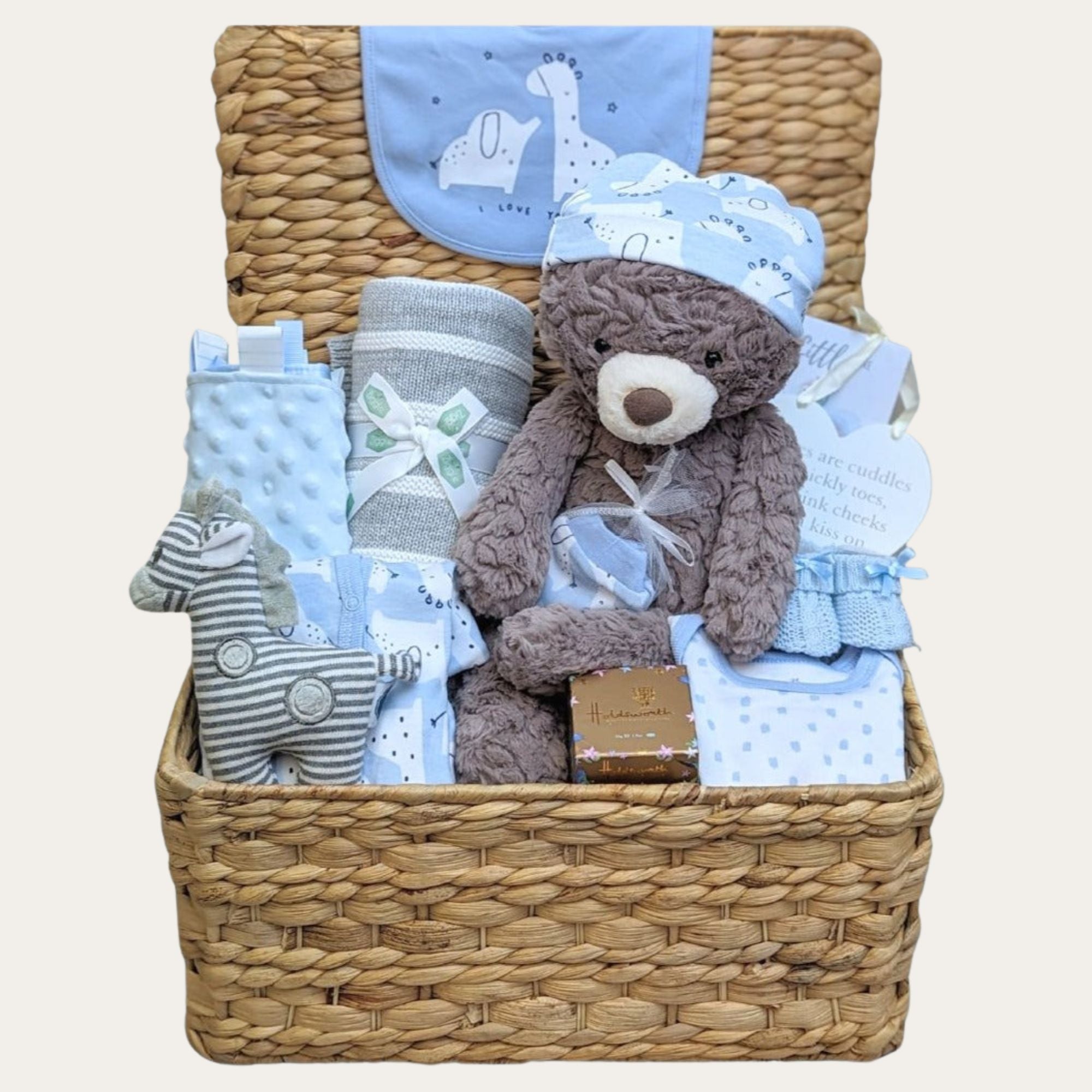 Baby boy hamper gifts basket with presents including blue baby clothes set, baby blanket, teddy bear, rattle and chocolates for mum.