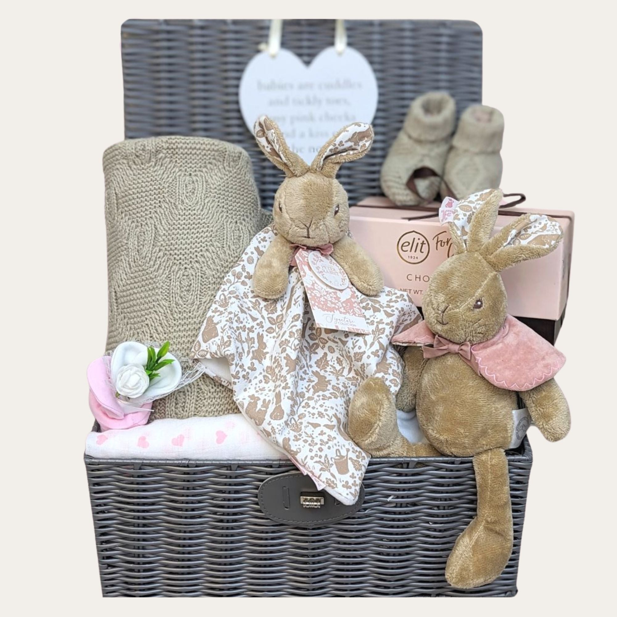 Baby girl hamper basket with flopsy bunny theme gifts, baby blanket, chocolates, muslin and baby booties.