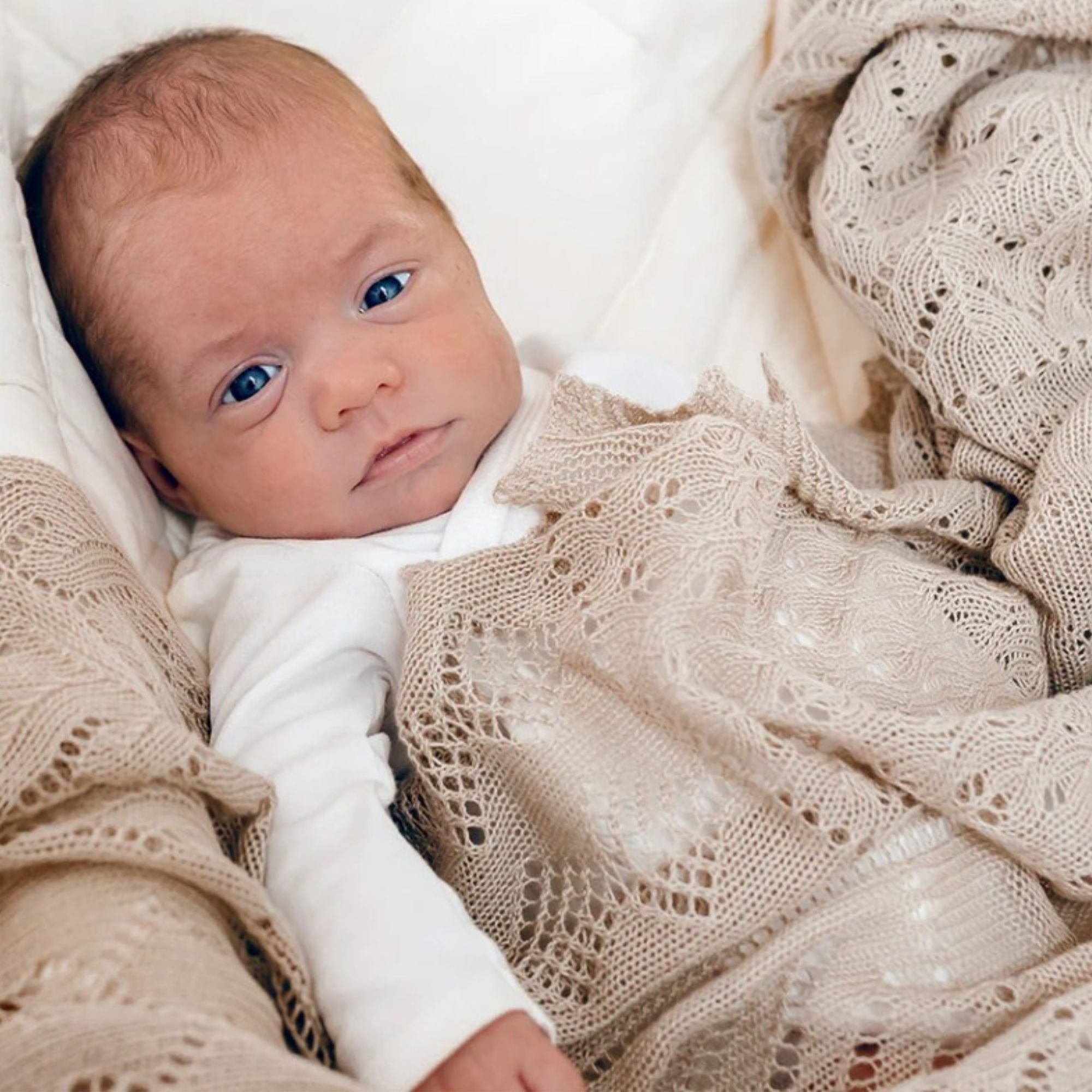 Lightweight oatmeal patchwork baby shawl, soft and delicate, ideal for a luxury baby gift.