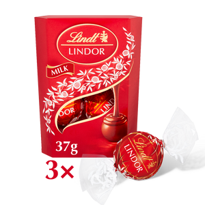 A small gift box containing 3 chocolate truffle balls from Lindt
