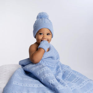 Super soft sky blue baby blanket with pom poms made from recycled yarn