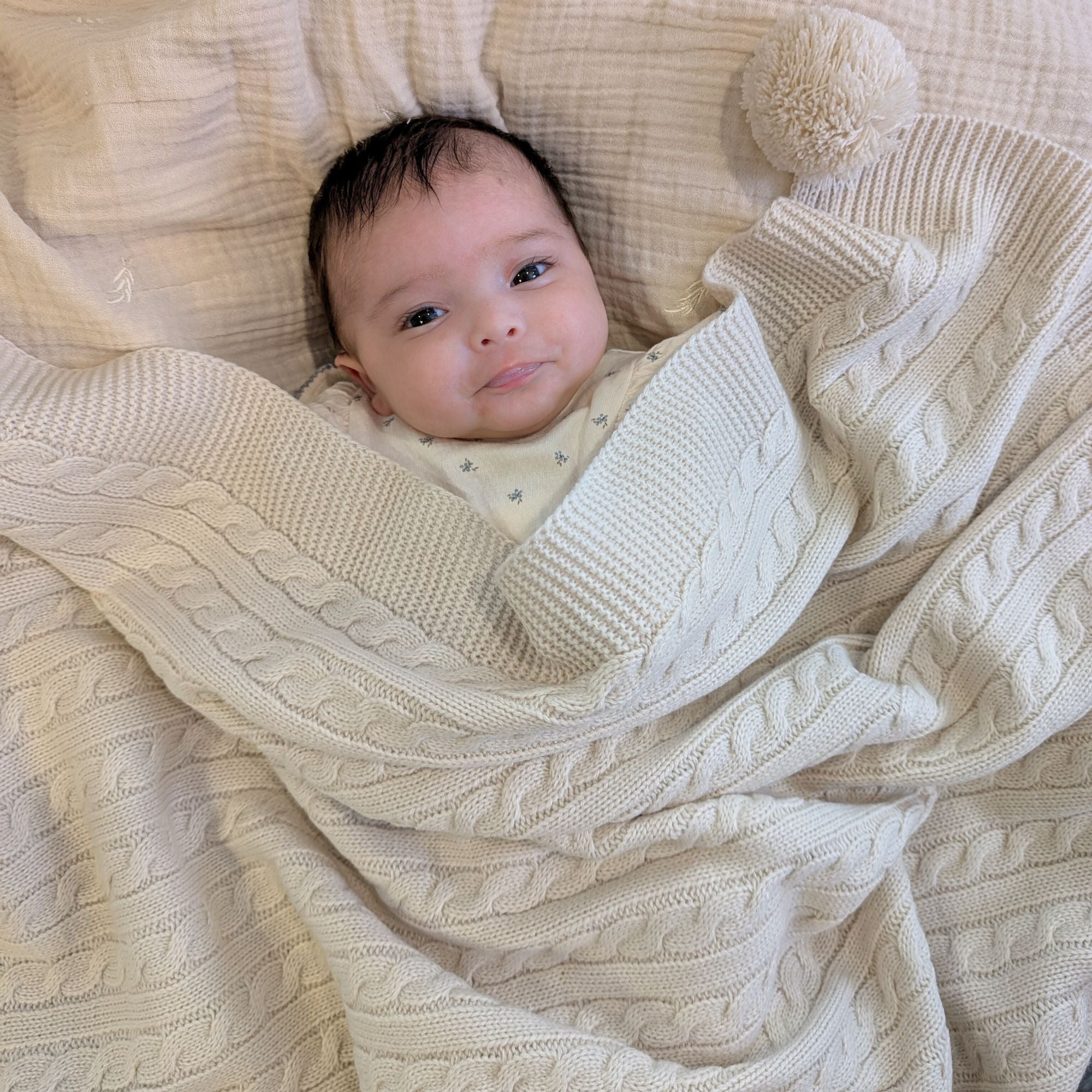 beige baby knit blanket with pompom