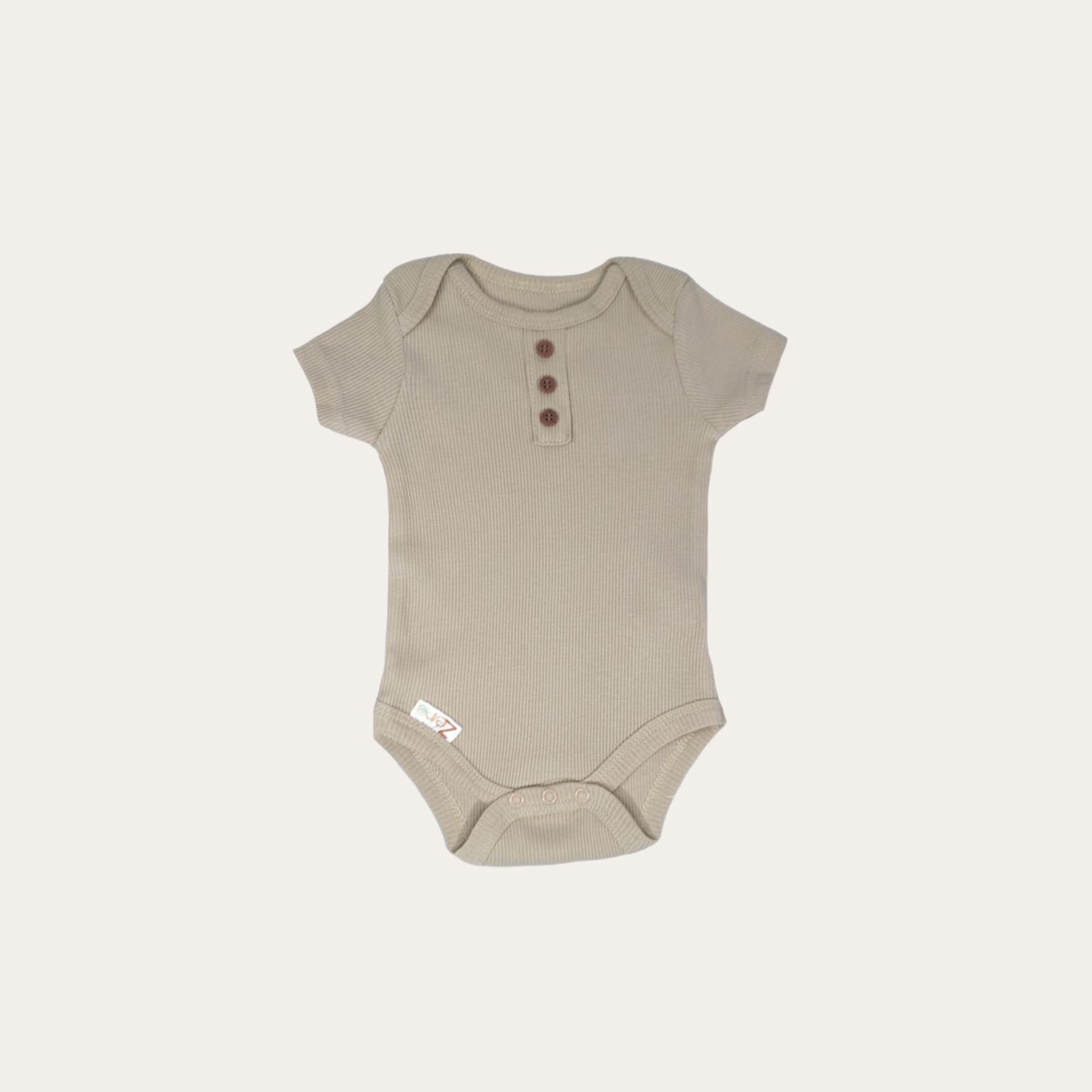 An oeko Tex biscuit coloured body suit