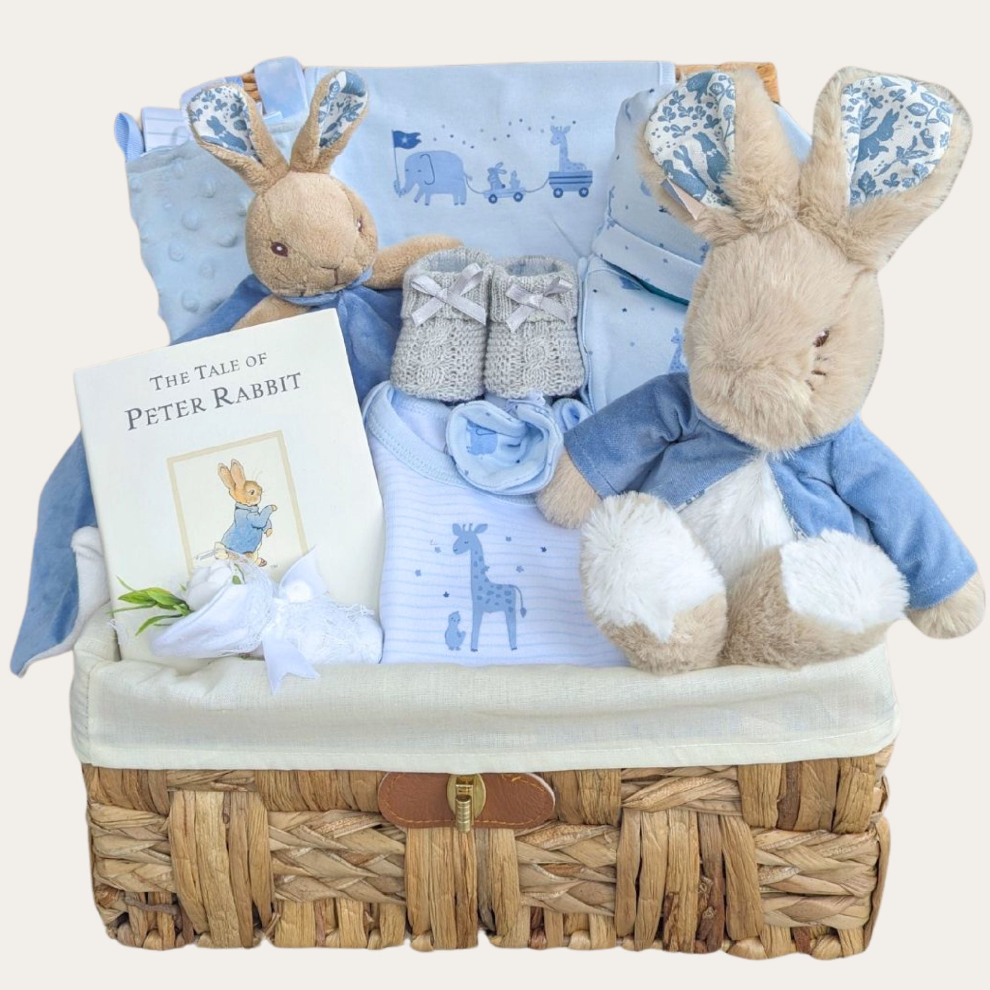 Baby boy gifts hamper with Peter Rabbit theme and newborn clothes gift set.