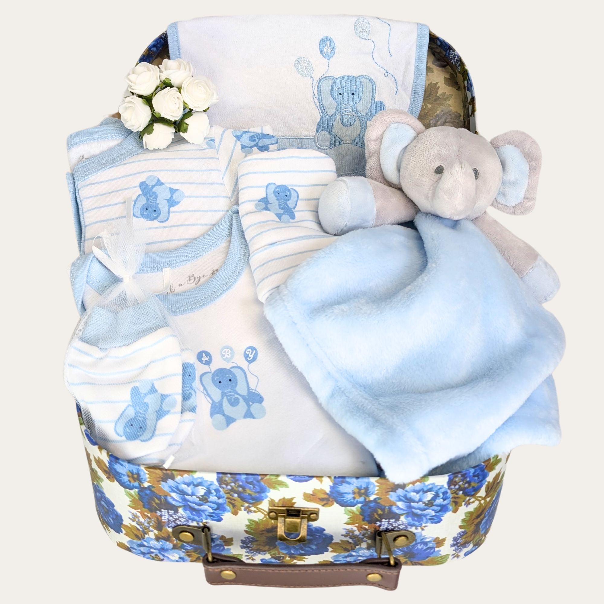 Baby boy gifts hamper with gifts including a blue balloon clothes set and a personalised elephant comforter soft toy.