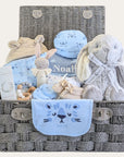 Personalised baby boy hamper with gifts including bunny and newborn clothes set.