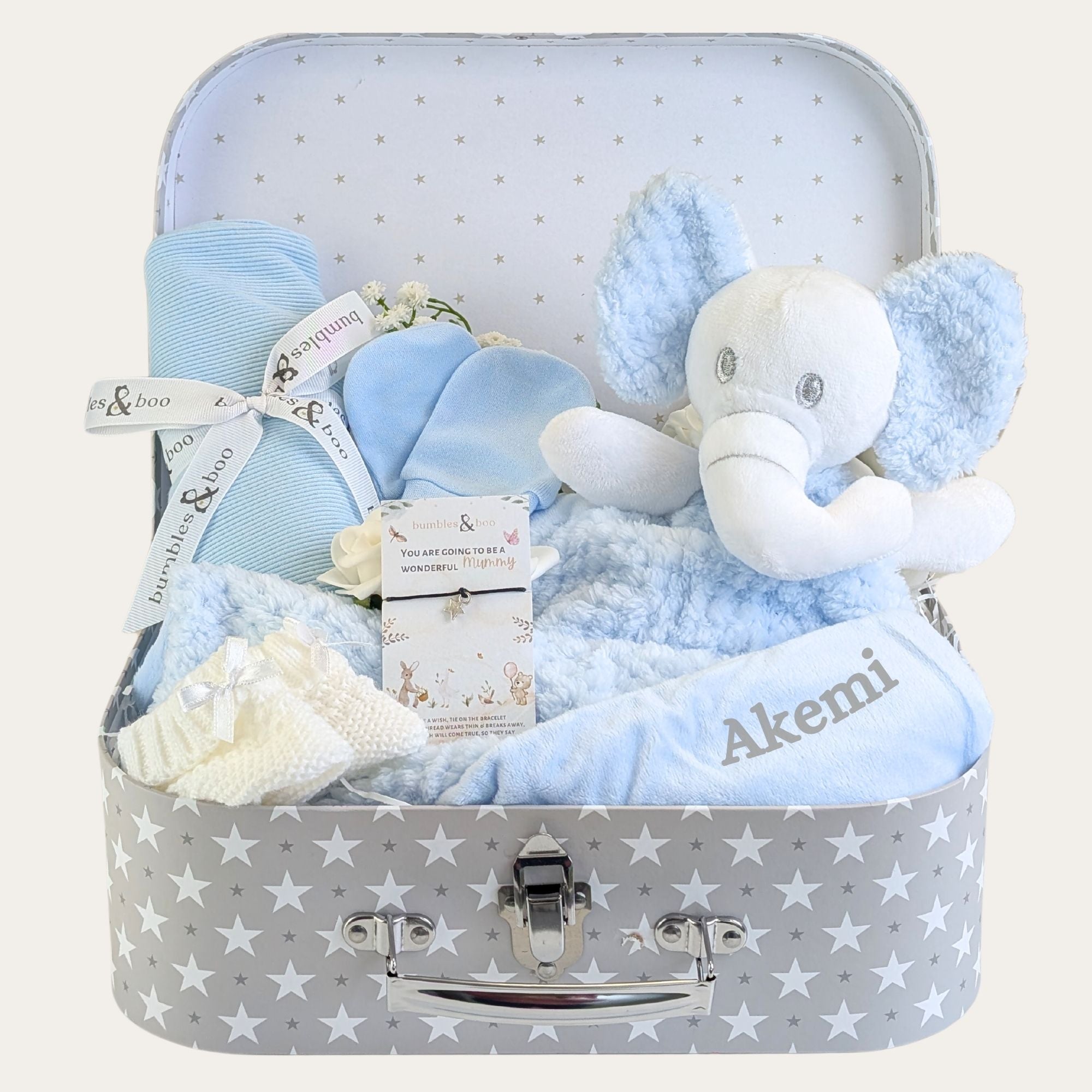 Baby boy hamper keepsake with gifts including blue elephant baby comforter and other blue presents.