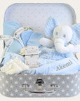 Baby boy hamper keepsake with gifts including blue elephant baby comforter and other blue presents.