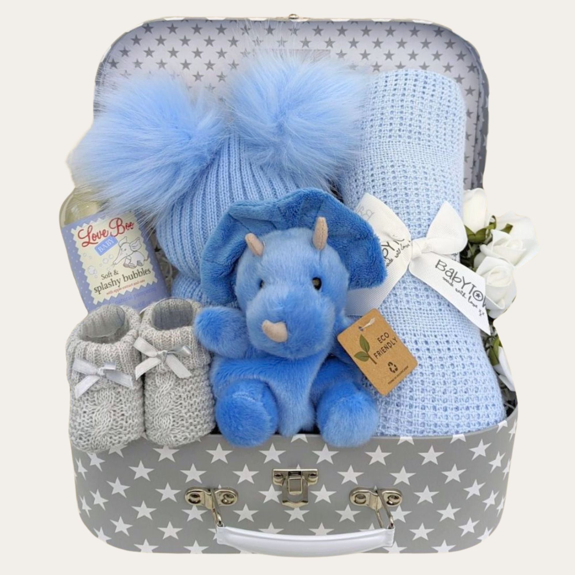 New baby boy hamper gifts box with blue dinosaur, cellular blanket, fluffy hat and baby booties.