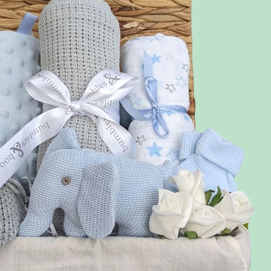 Baby Boy Gifts Hamper with Organic Elephant Rattle, grey cellular blanket, blue taggie and star muslin.