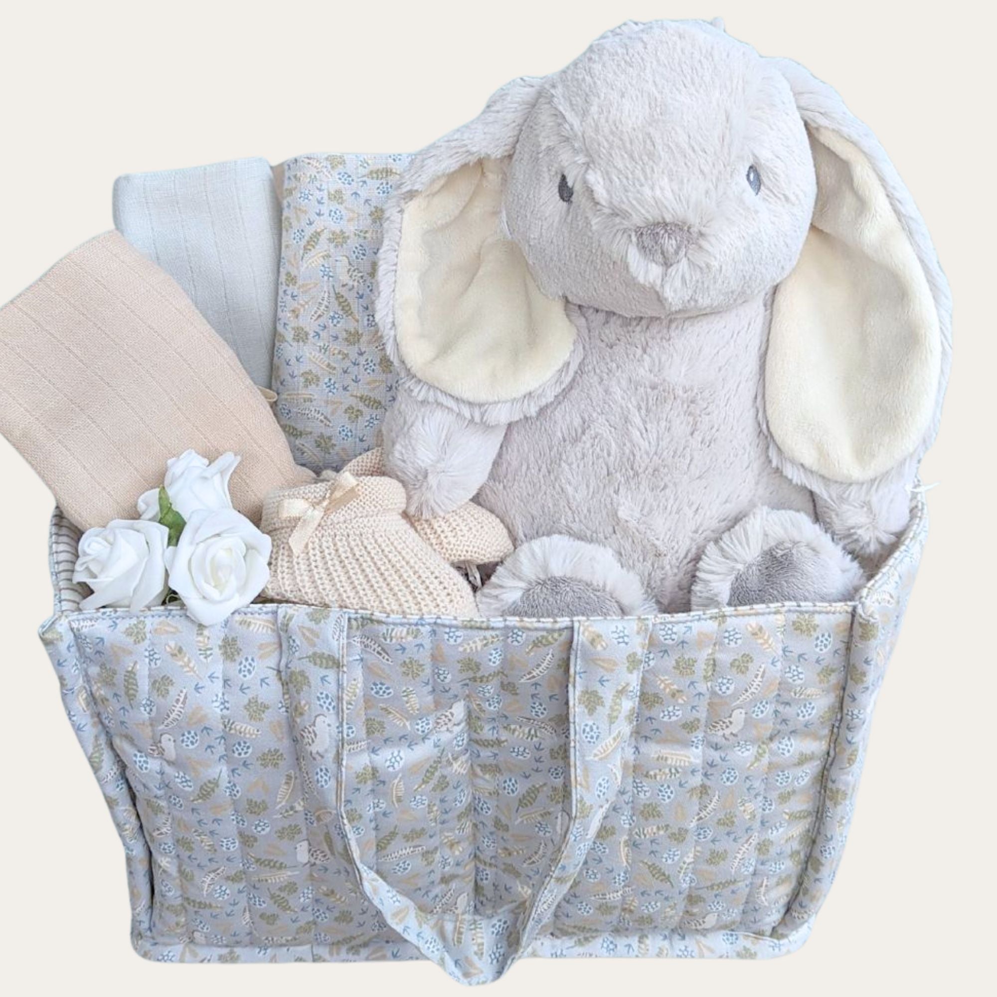 Baby boy hamper in a nappy caddy with gifts including bunny soft toy & muslins in a soft padded bag.