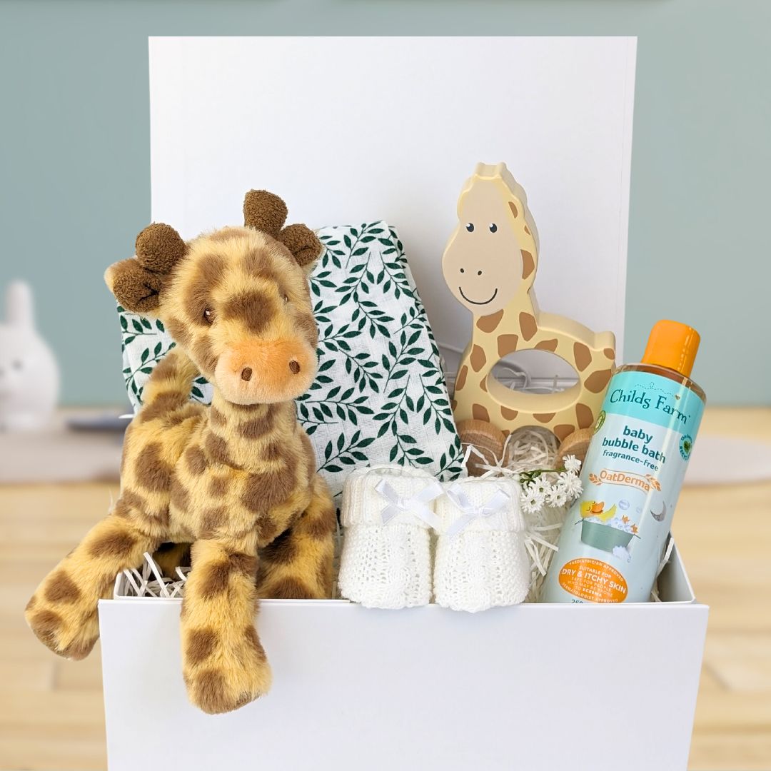 baby gift box with giraffe soft toy, giraffe pull along and organic skincare for baby.