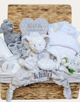 Unisex baby hamper basket with giraffe and elephant theme. Includes bath robe, blanket, personalised soft toy, milestone cards, muslin wrap and more.