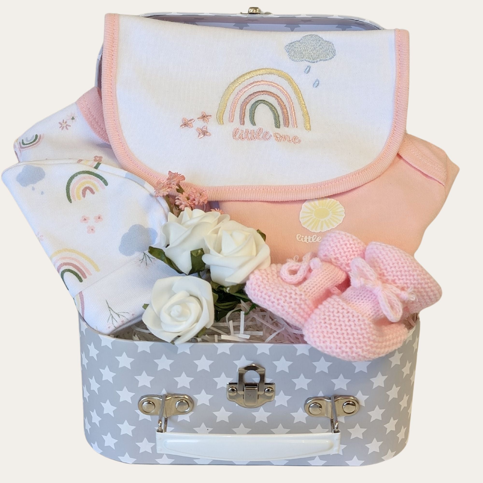 baby girl clothing gifts with rainbow theme in a baby hamper.