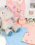 Baby girl gift bag with pink butterfly gifts clothes set and hungry hippo soft toy.