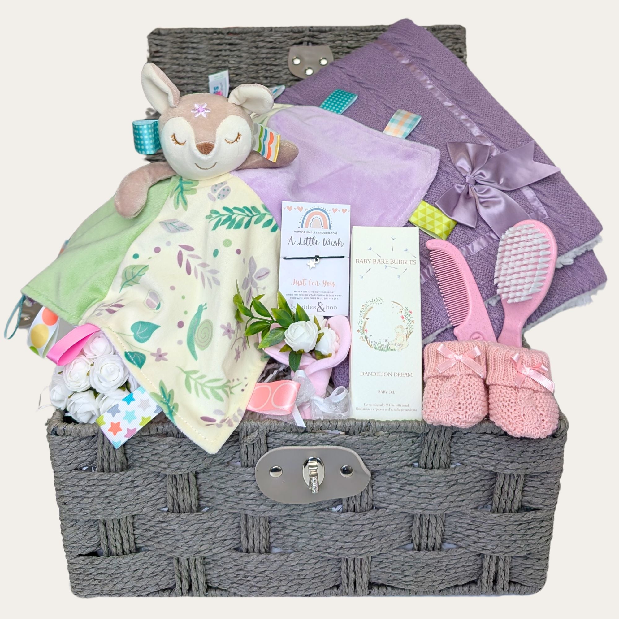 Baby girl gift hamper which includes Taggie Flora Fawn, organic baby oil, snug mittens, booties, a luxury blanket, a sweet brush set, and a heartfelt bracelet for mum. Bumbles and Boo.