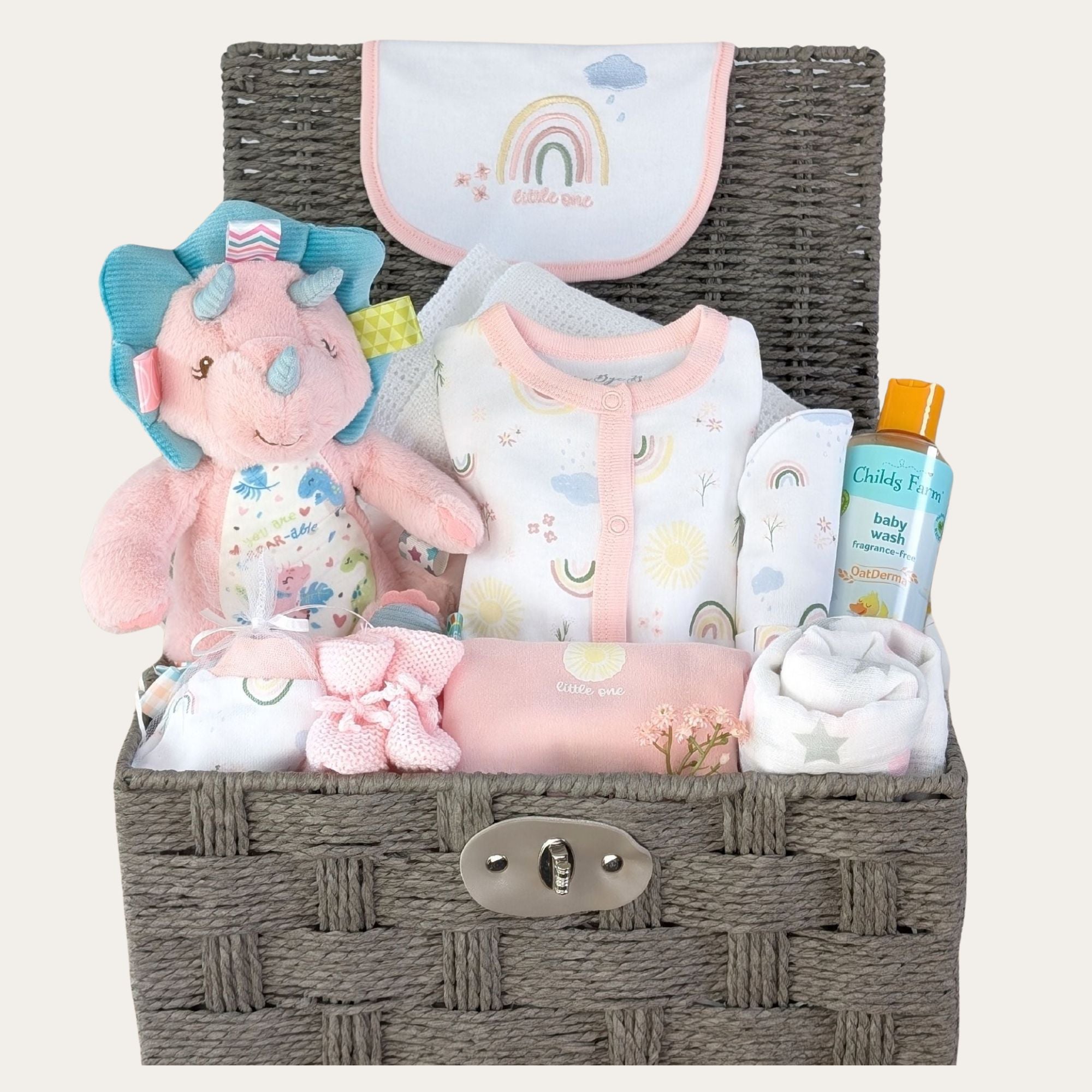 baby girl gifts hamper basket with pink baby clothes set and dotty dinosaur soft toy.