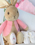 baby girl gifts box with flopsy bunny, cellular blanket, taggie comforter, baby socks and baby booties.