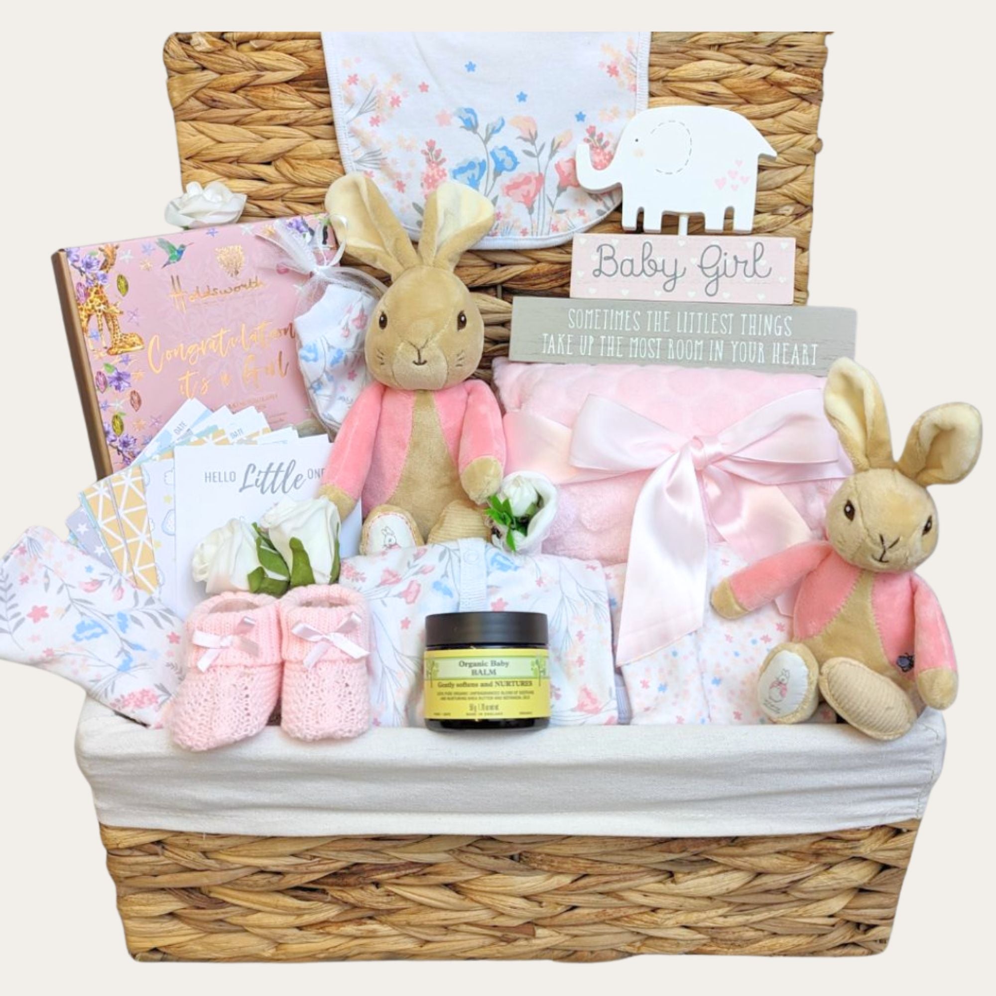 baby girl gifts-hamper basket with packed with pink gifts including flopsy bunny toys, newborn clothing set, chocolates and baby skincare