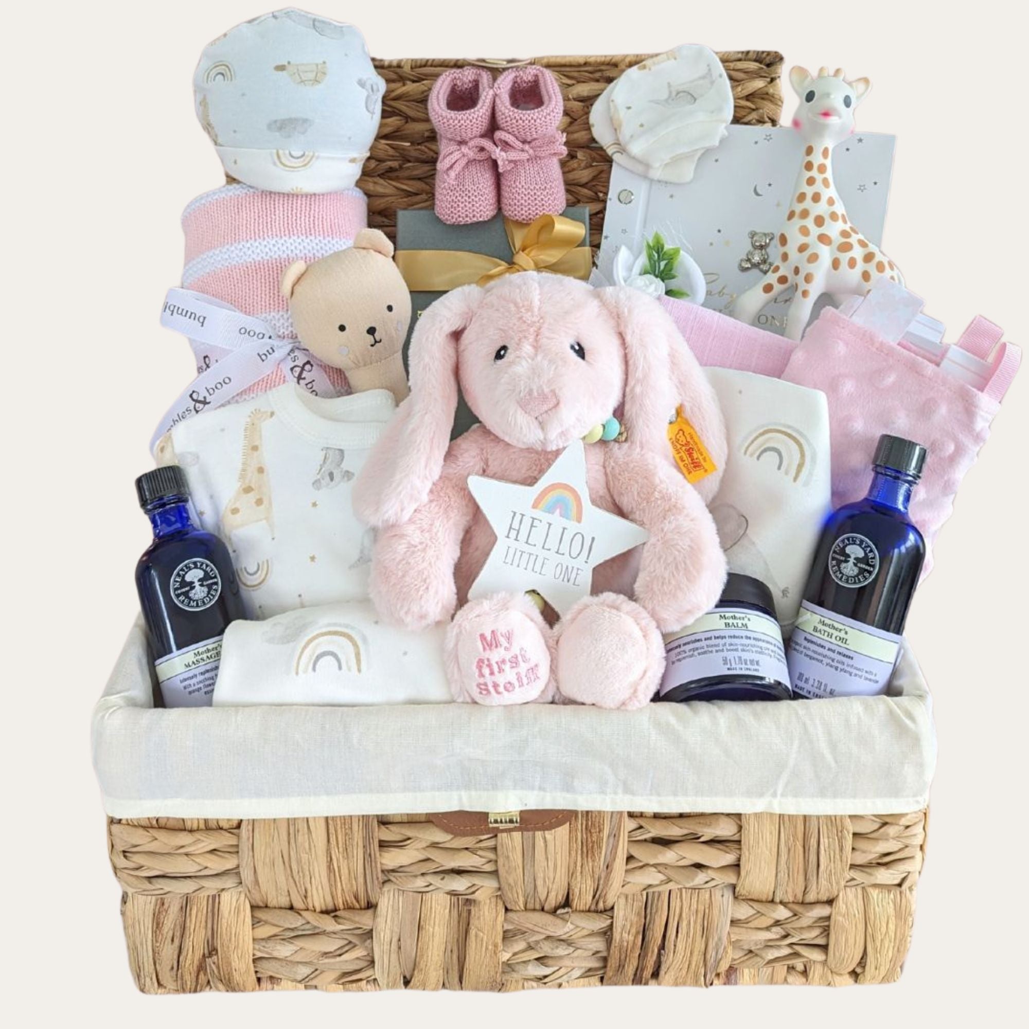 Baby girl gifts hamper basket packed with luxury pink and white presents for mum and baby.