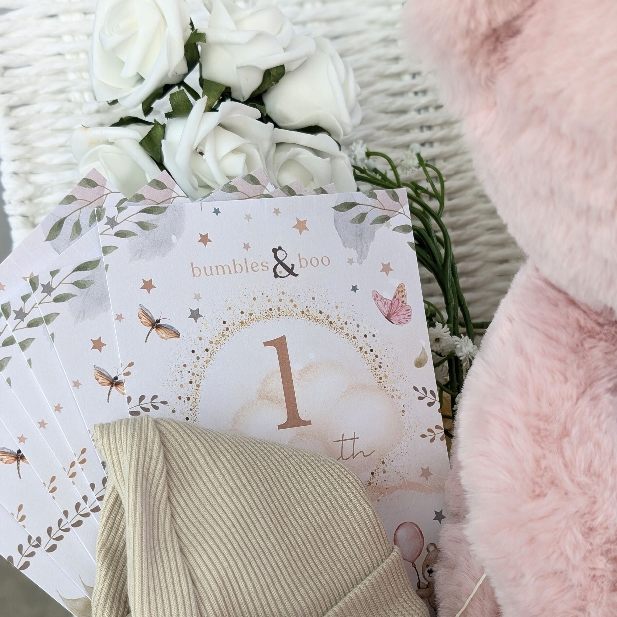 baby girl gifts hamper with large dusky pink teddy, chocolates, theething rings, nursery plaque, baby booties, hat and milestone cards.