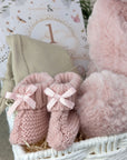 baby girl gifts hamper with large dusky pink teddy, chocolates, theething rings, nursery plaque, baby booties, hat and milestone cards.