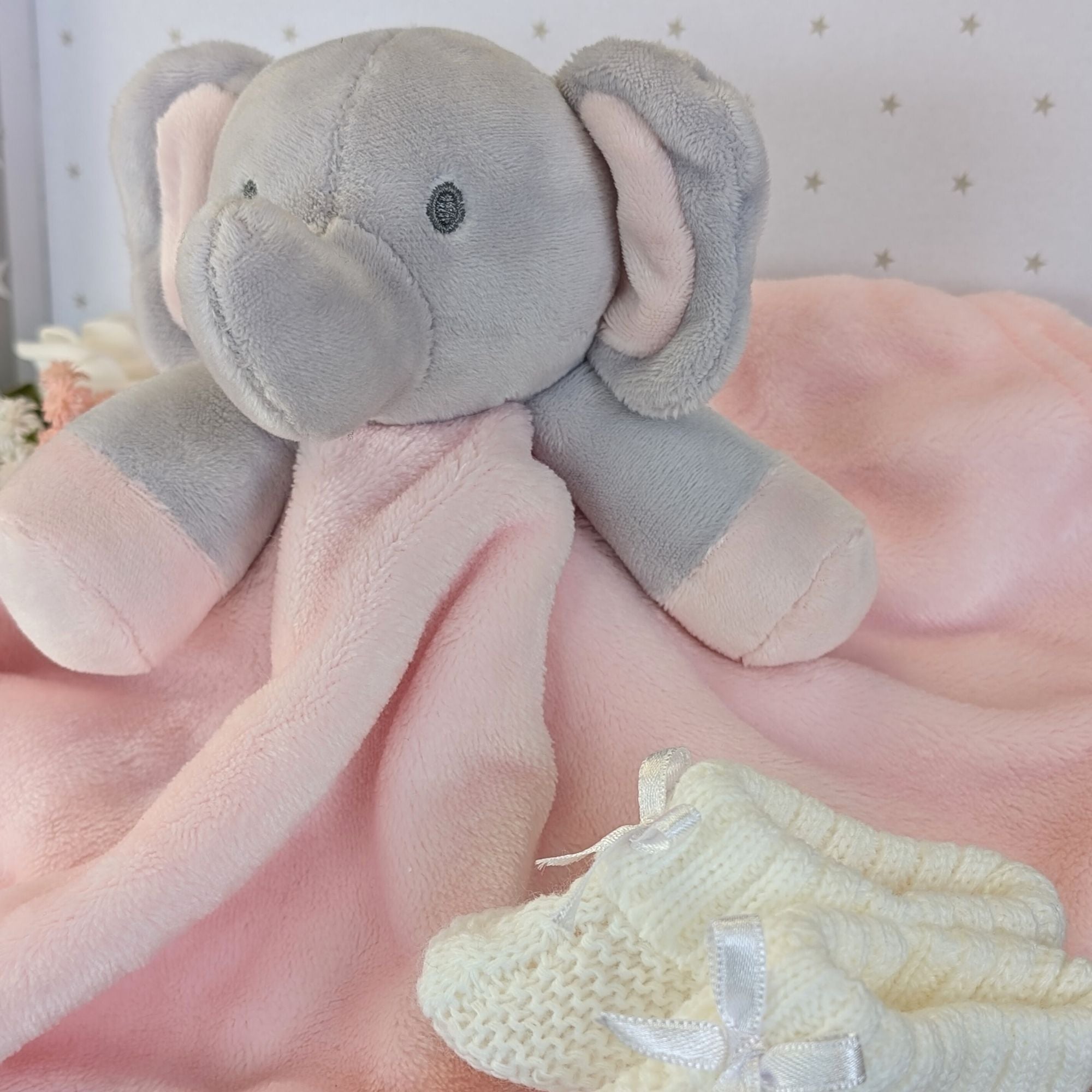 baby girl gifts trunk with pink elephant comforter, baby booties, baby mittens and bracelet for mum