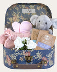 blue floral baby girl gifts hamper with elephant soft toy & tea in a suitcase.