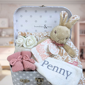 baby girl gifts keepsake trunk with flopsy bunny and knit baby girl booties.