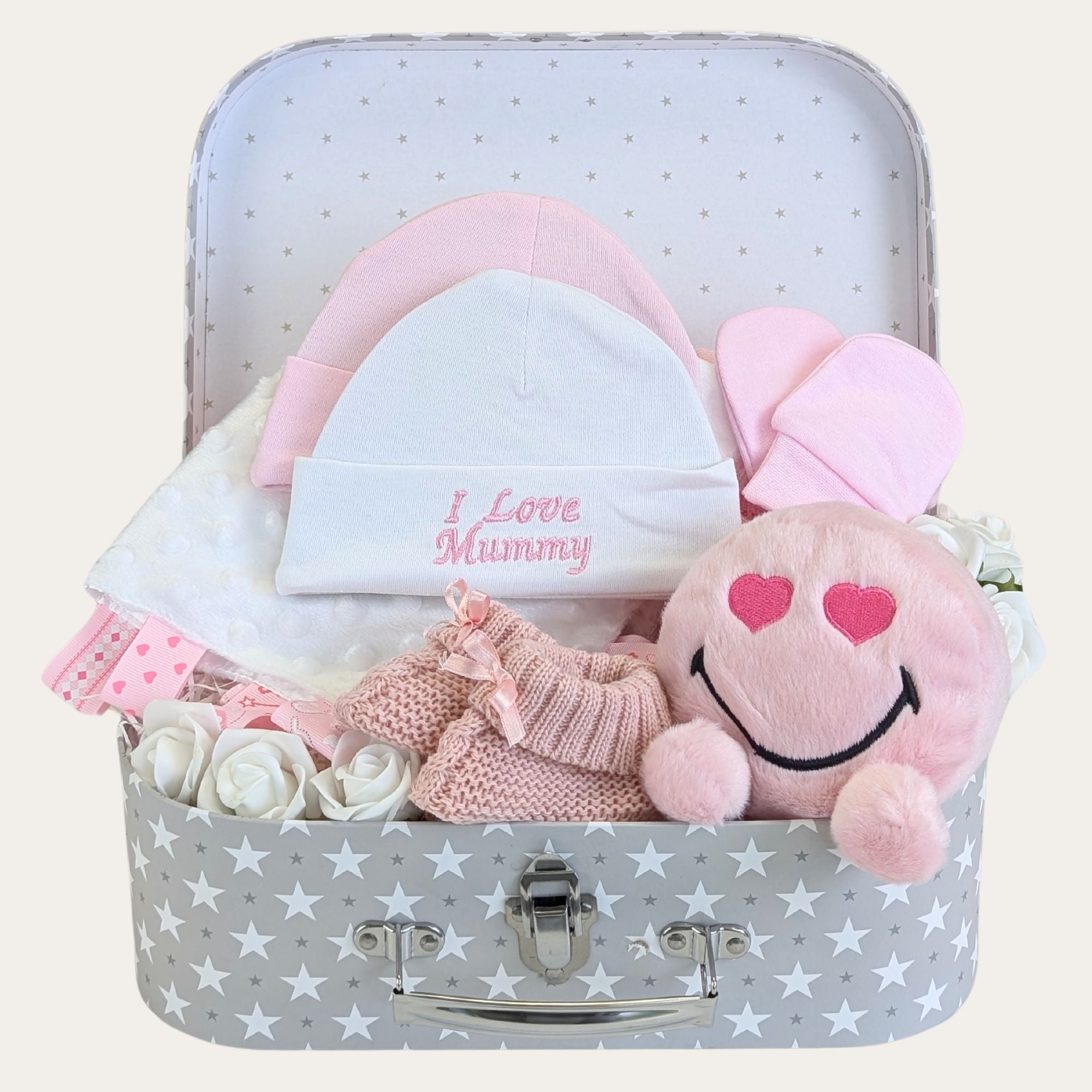 baby girl gifts hamper with pink emoji soft toy with hearts for eyes. Hats say 'I love Mummy', blanket, mittens, booties.