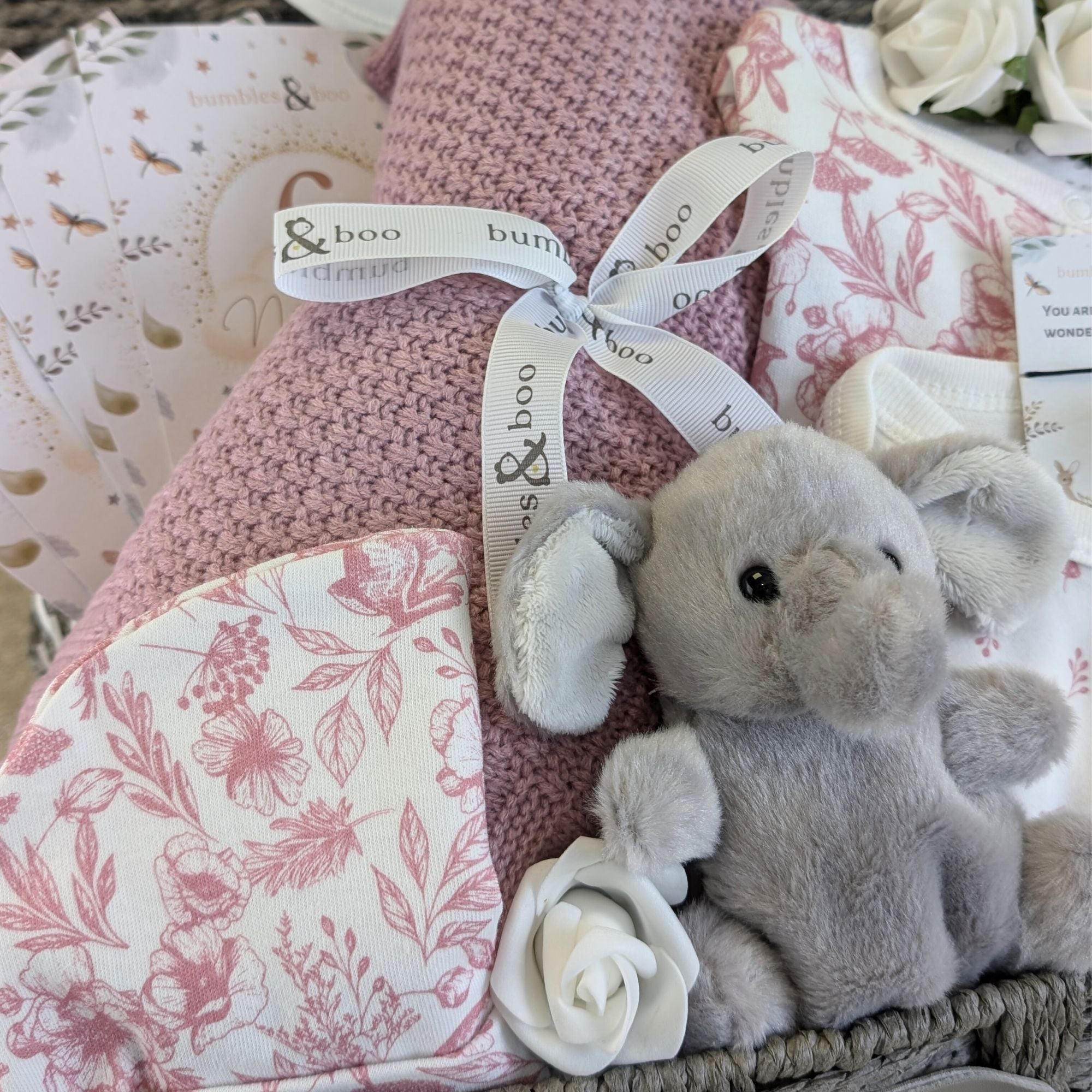 baby girl hamper with dusky pink clothing set, baby blanket and elephant soft toy.