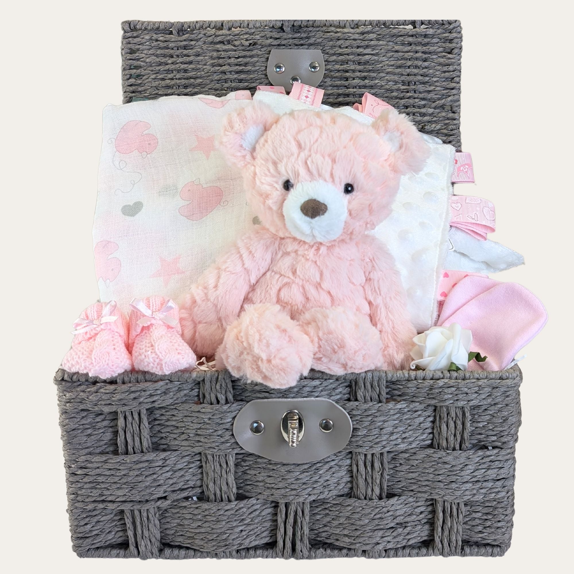 baby girl gifts hamper with teddy bear, muslin, taggie, mittens and booties.