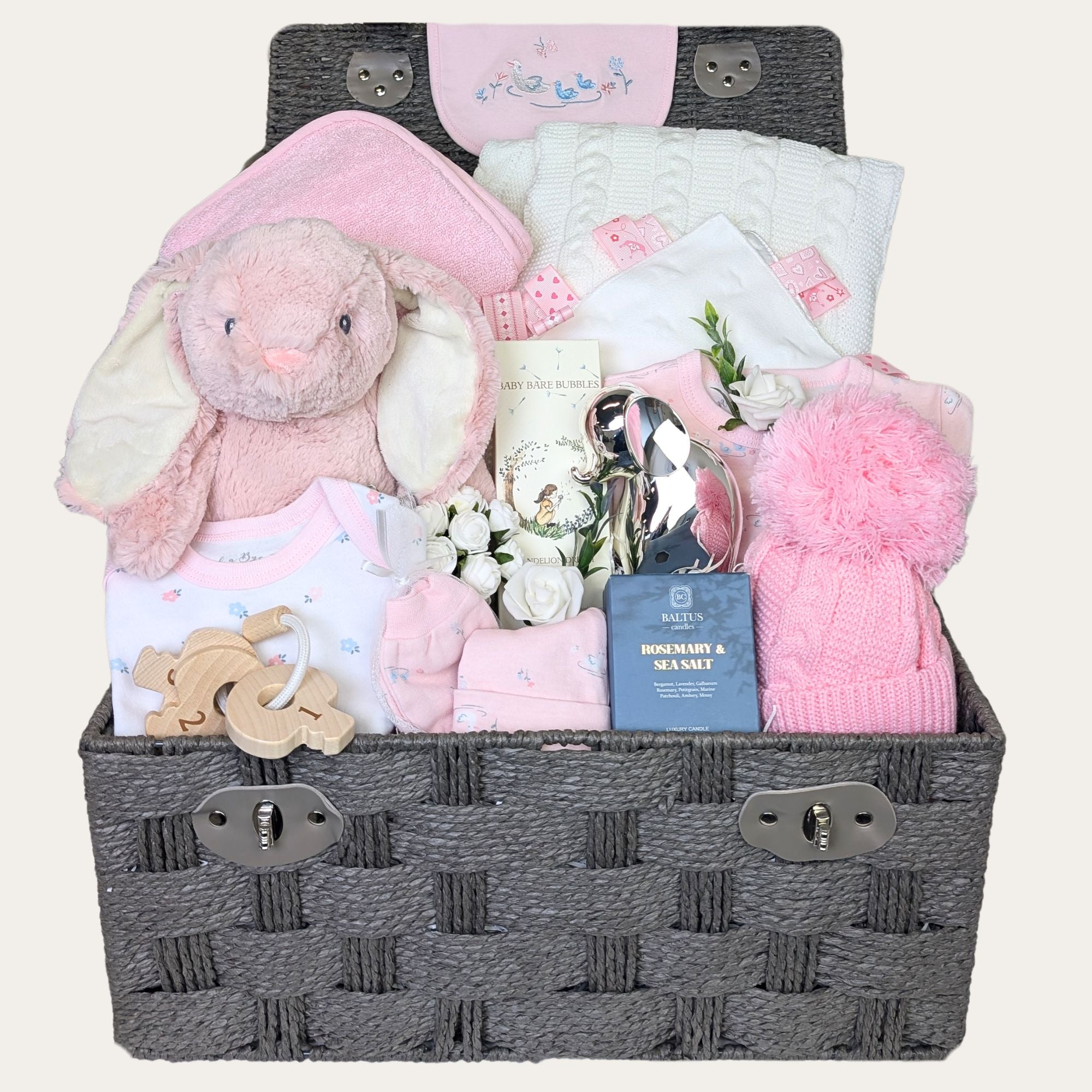 baby girl hamper gift with bunny, towel, blanket, baby skincare, clothing, hat, candle and teething keys. Bumbles and Boo.