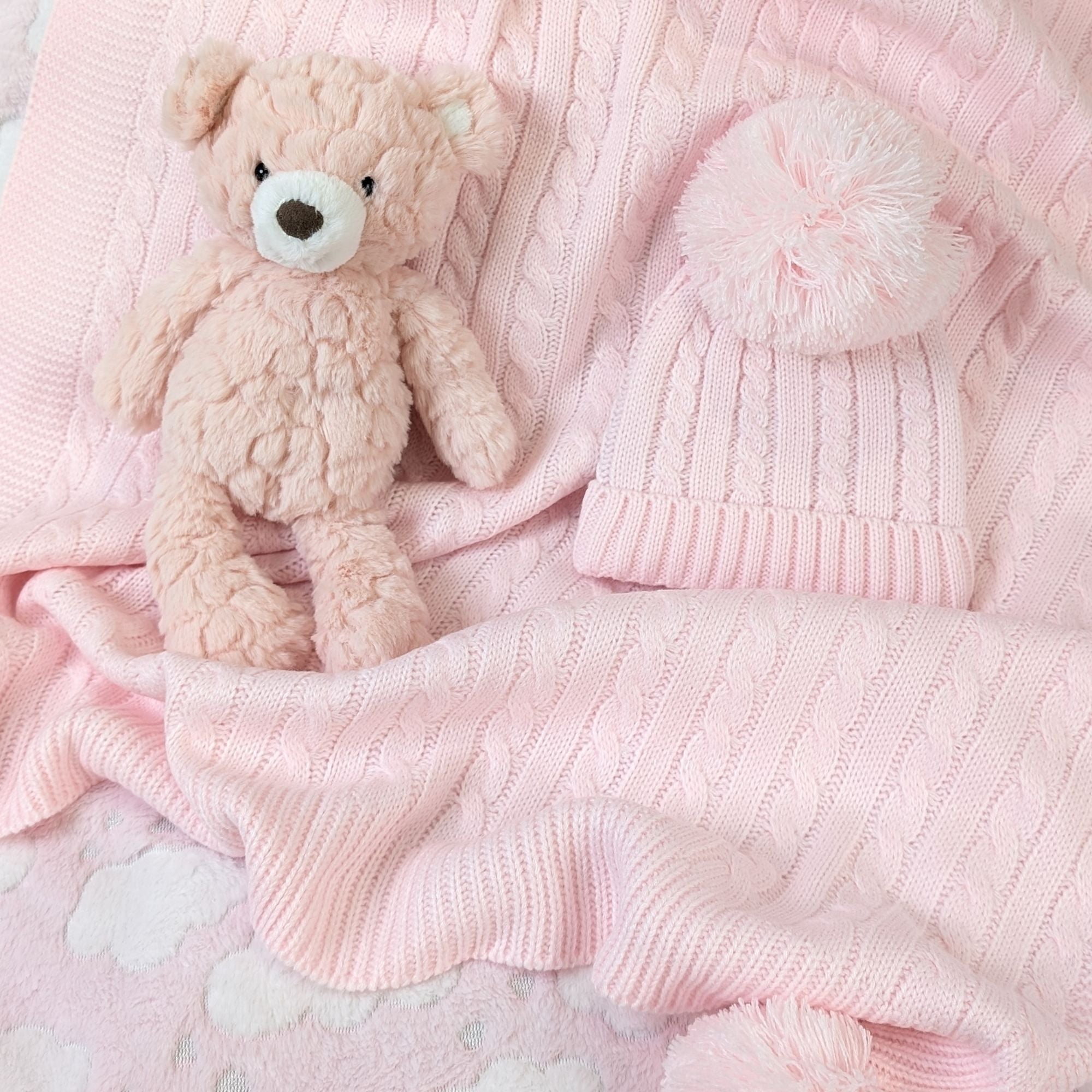 baby knit blanket with pompoms in pink with matching knit pompom hat bumbles and boo