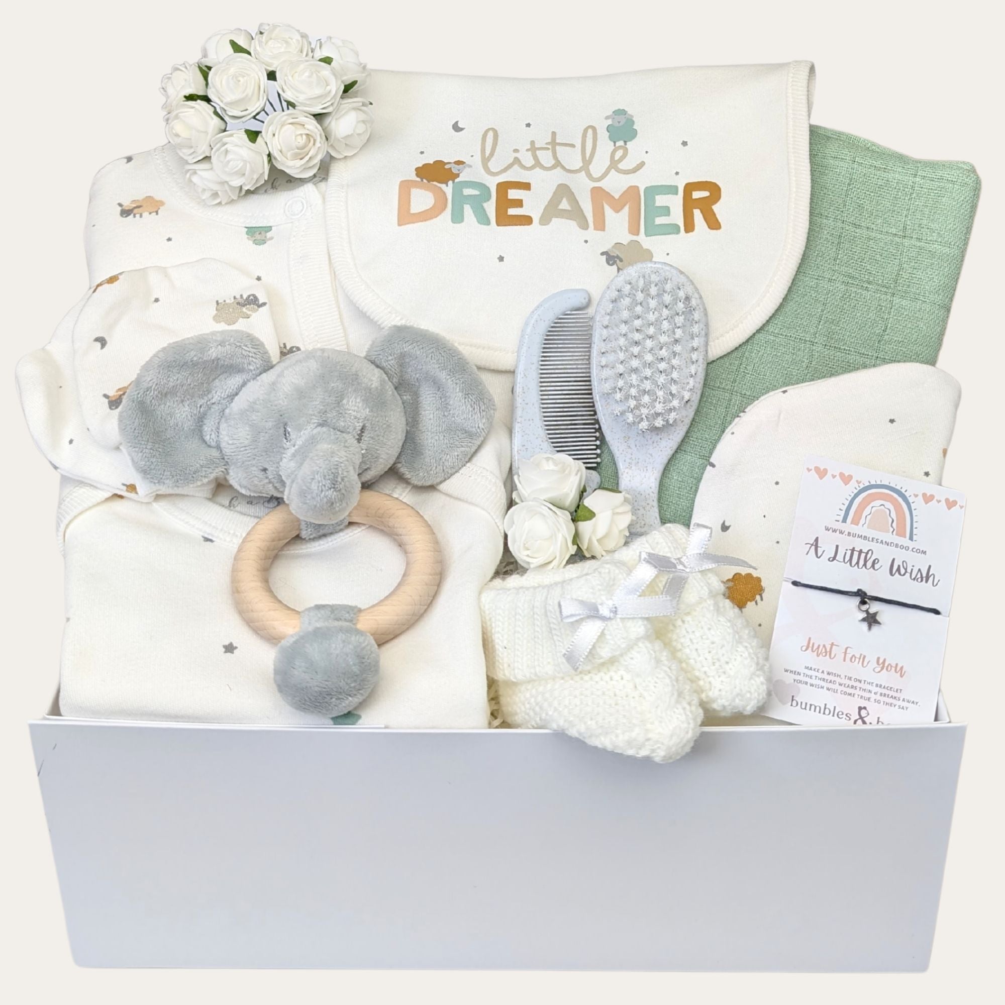 baby shower gifts hamper with a clothing set, brush and comb set, bracelet, muslin and baby rattle.