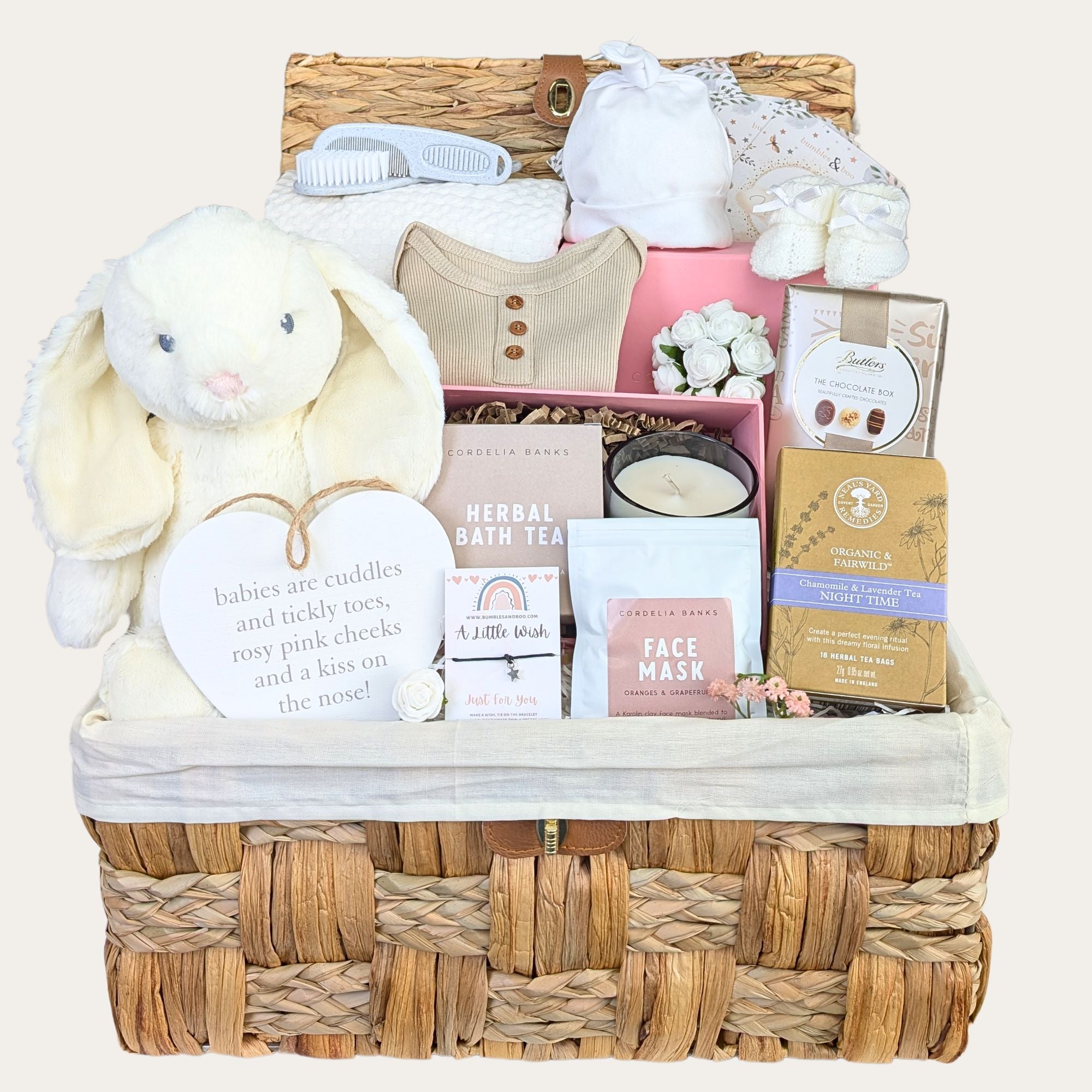 Baby shower gifts hamper with white bunny soft toy and gifts for mum packed in a basket by Bumbles and Boo.