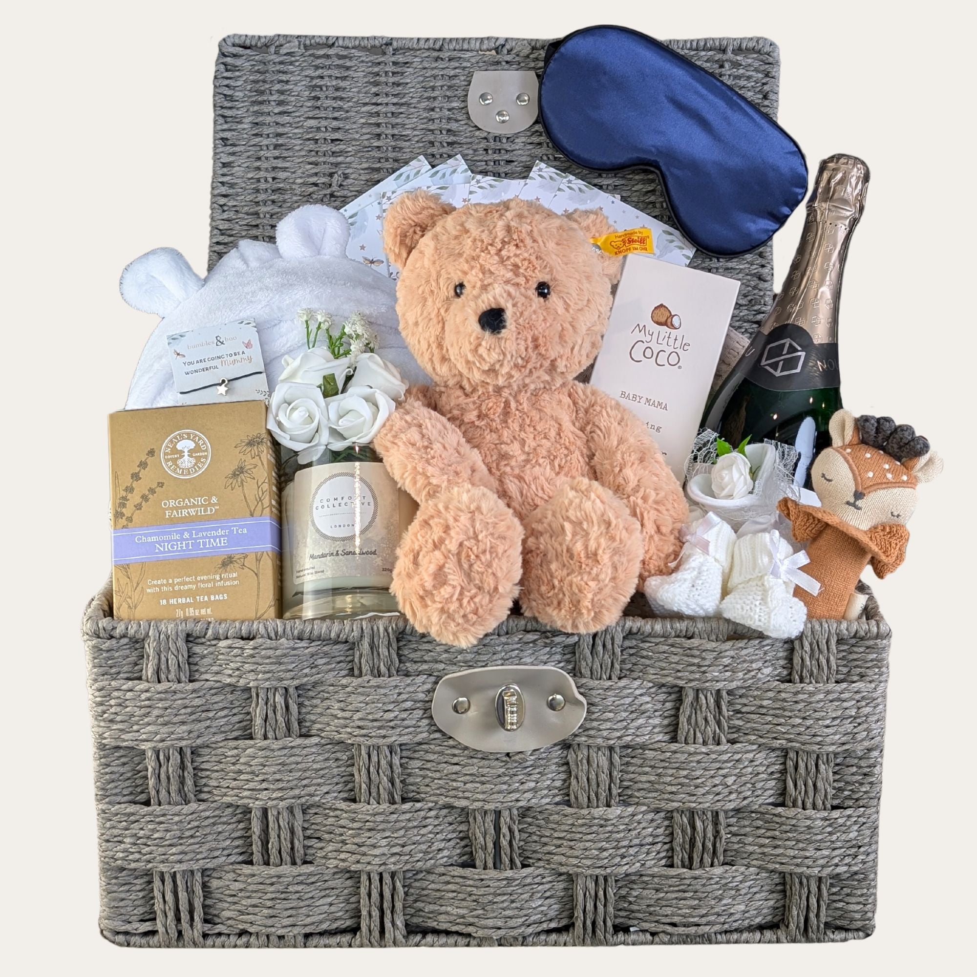 baby shower hamper basket packed with lots of gifts for mum and baby. This large hamper features a teddy, dressing gown and more.