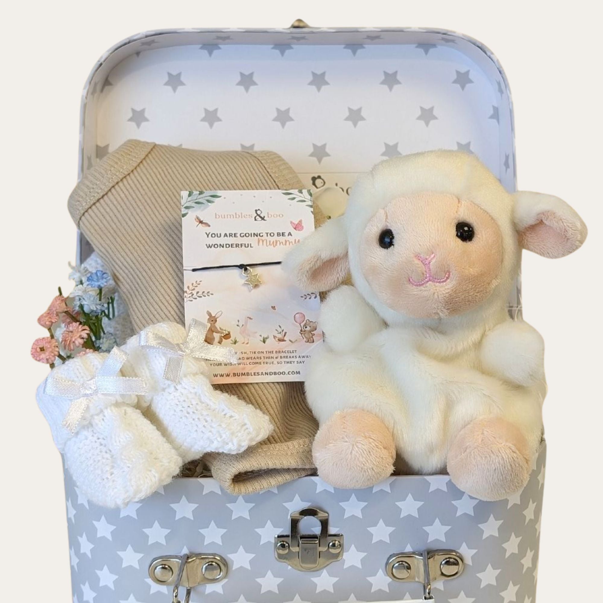 baby shower gifts hamper with small lamb soft toy, baby bib, bracelet for mum and booties.