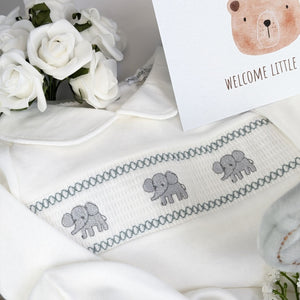 baby shower gifts box with white baby romper with elephant on