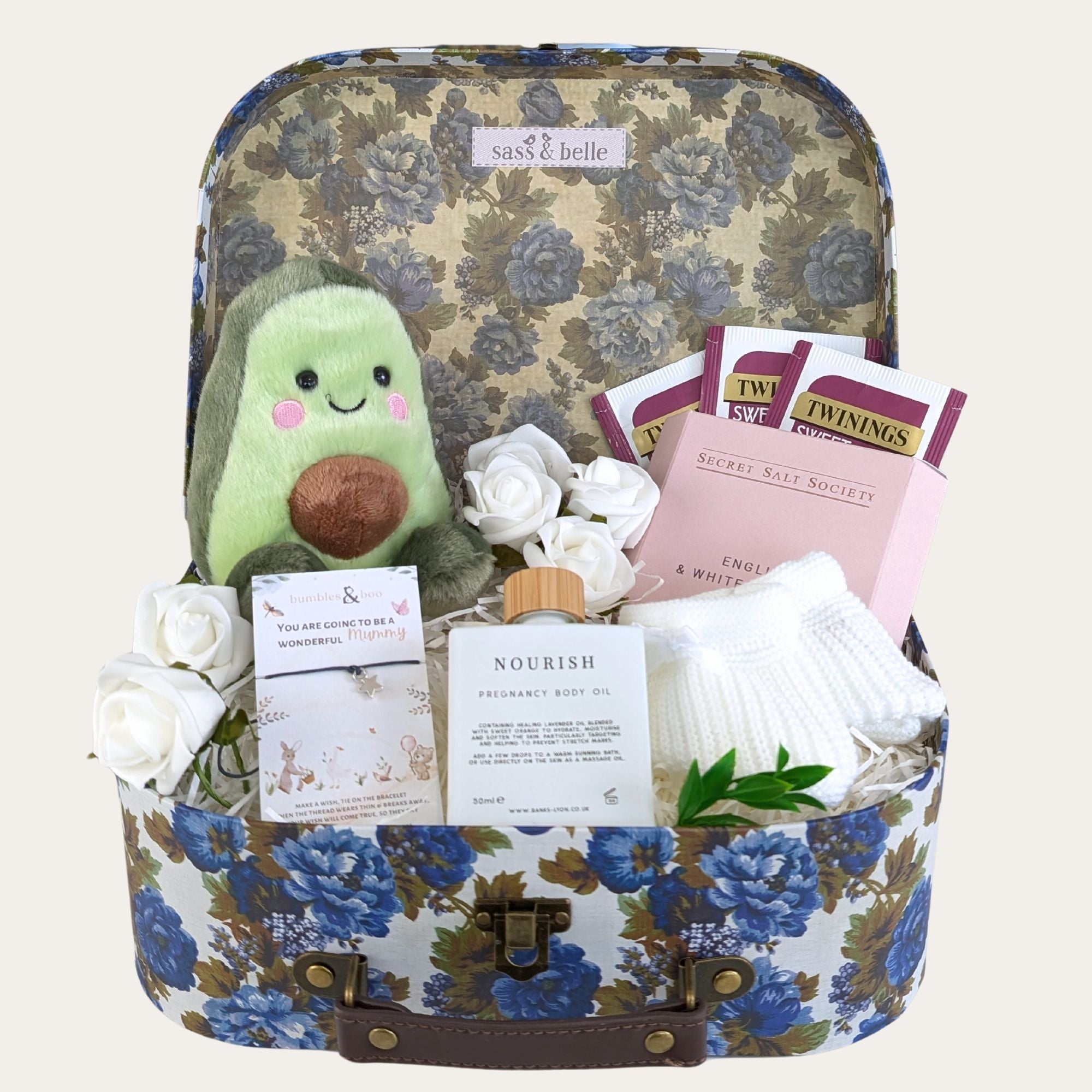 baby shower gifts hamper with organic tea, pregnancy oil, bracelet for mum and an avocado toy for the new baby. 