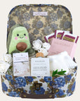 baby shower gifts hamper with organic tea, pregnancy oil, bracelet for mum and an avocado toy for the new baby. 