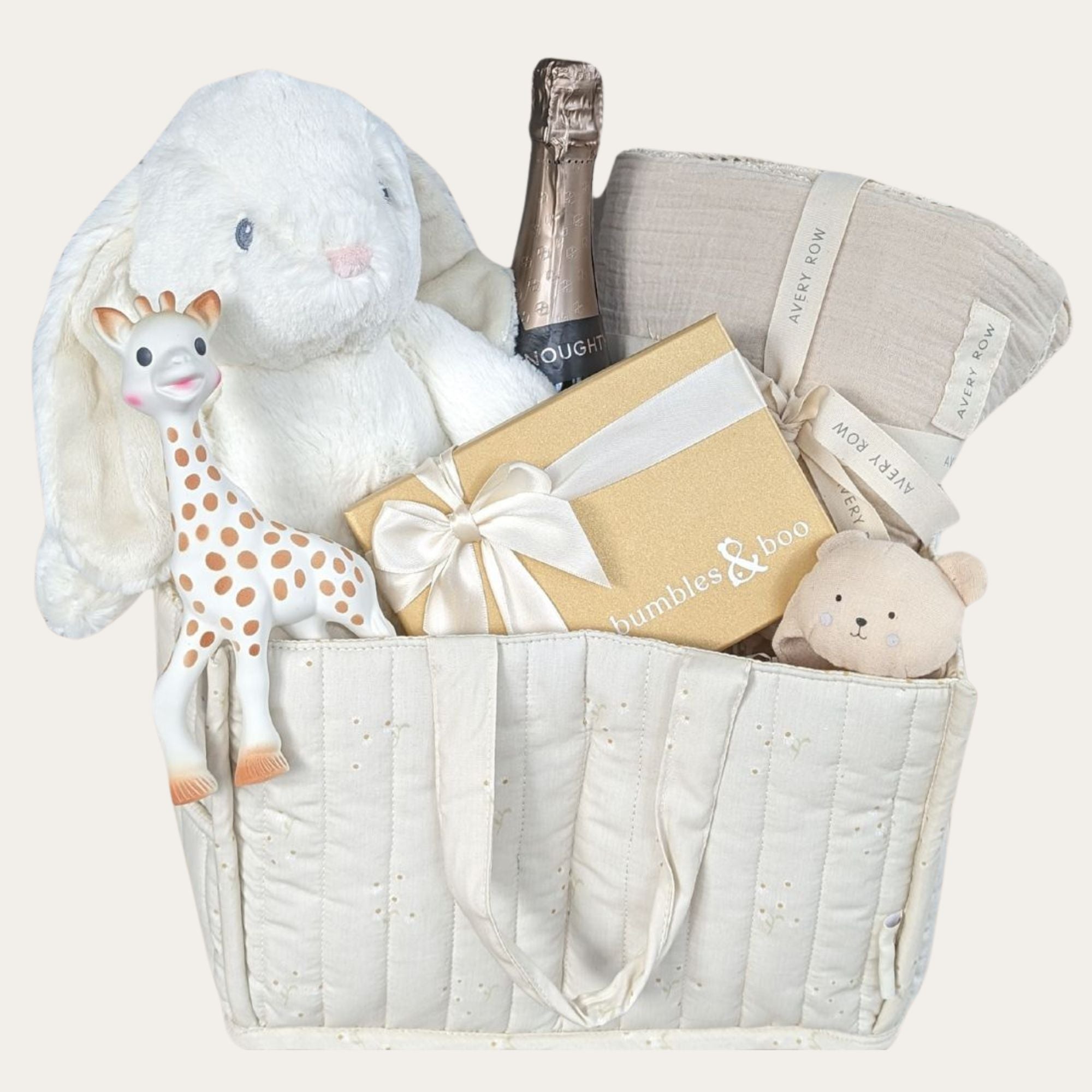 baby shower gifts hamper with bunny, sophie la girafe, blanket, chocolates and more presents packed in a nappy bag caddy.