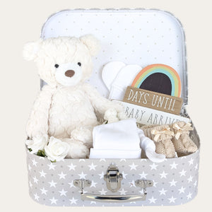 Baby shower gifts hamper with white teddy and rainbow plaque, booties, hat and mittens.