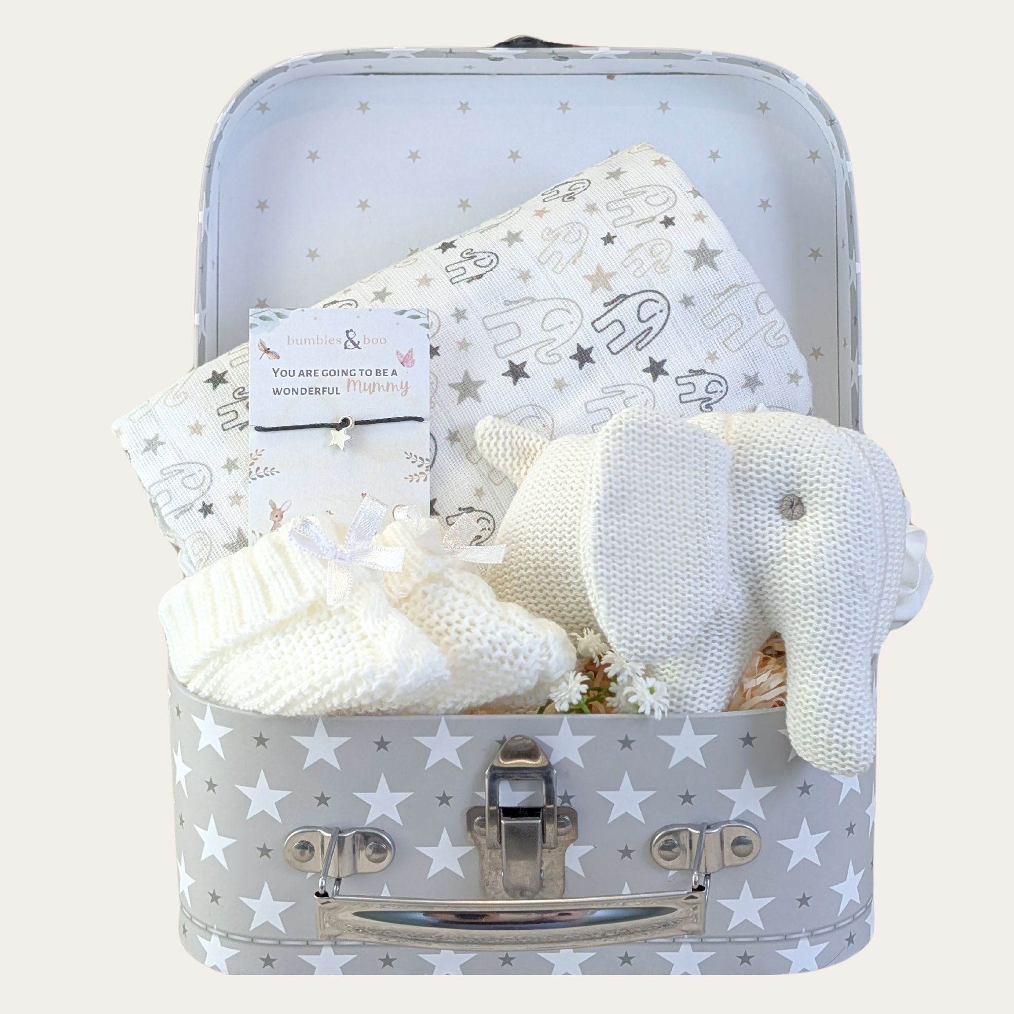 Baby shower gifts hamper with white elephant baby rattle, muslin, booties and wish string.