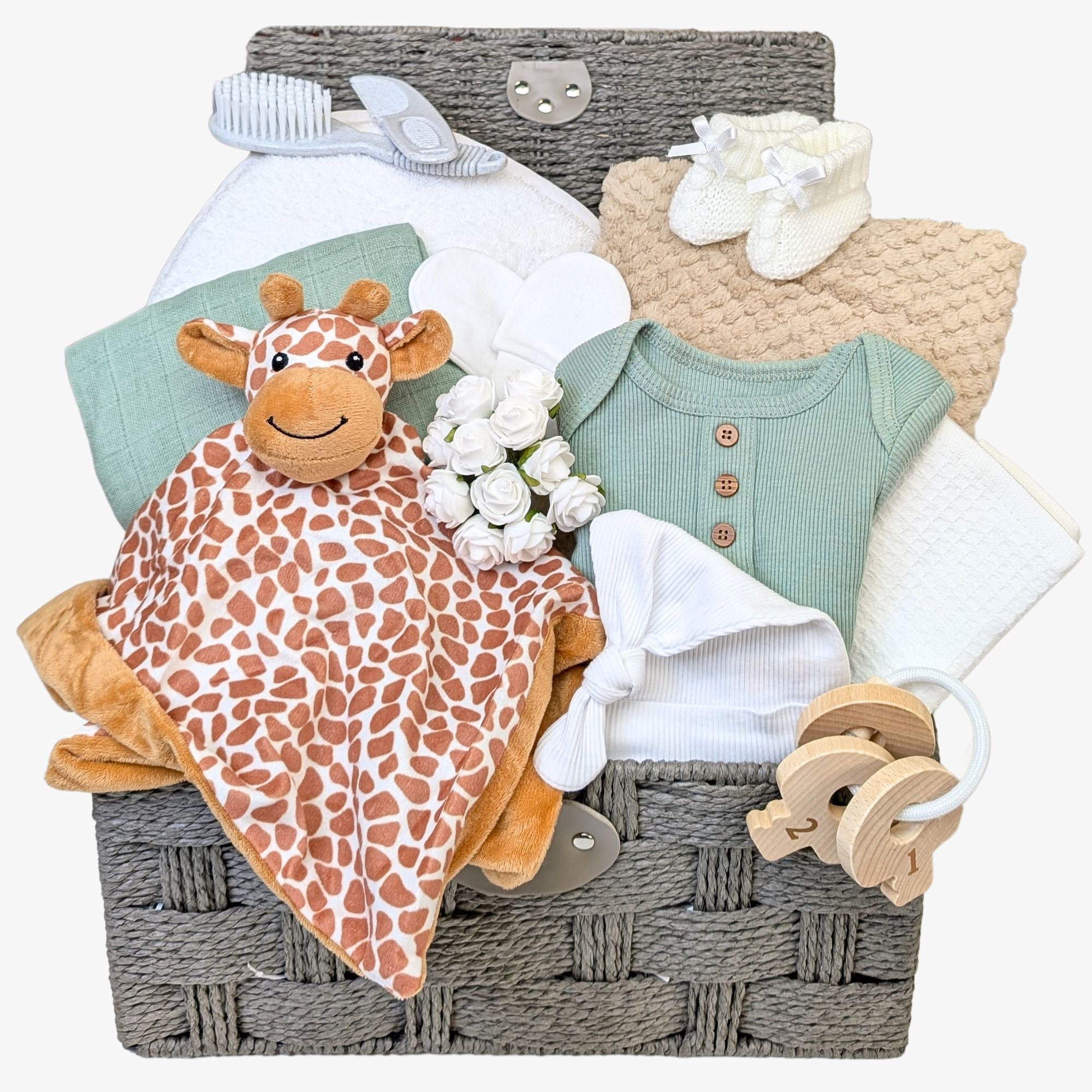 baby shower hamper with giraffe comforter, muslin square, baby towel, brush and comb, blanket, clothing, teething keys. Bumbles and Boo.