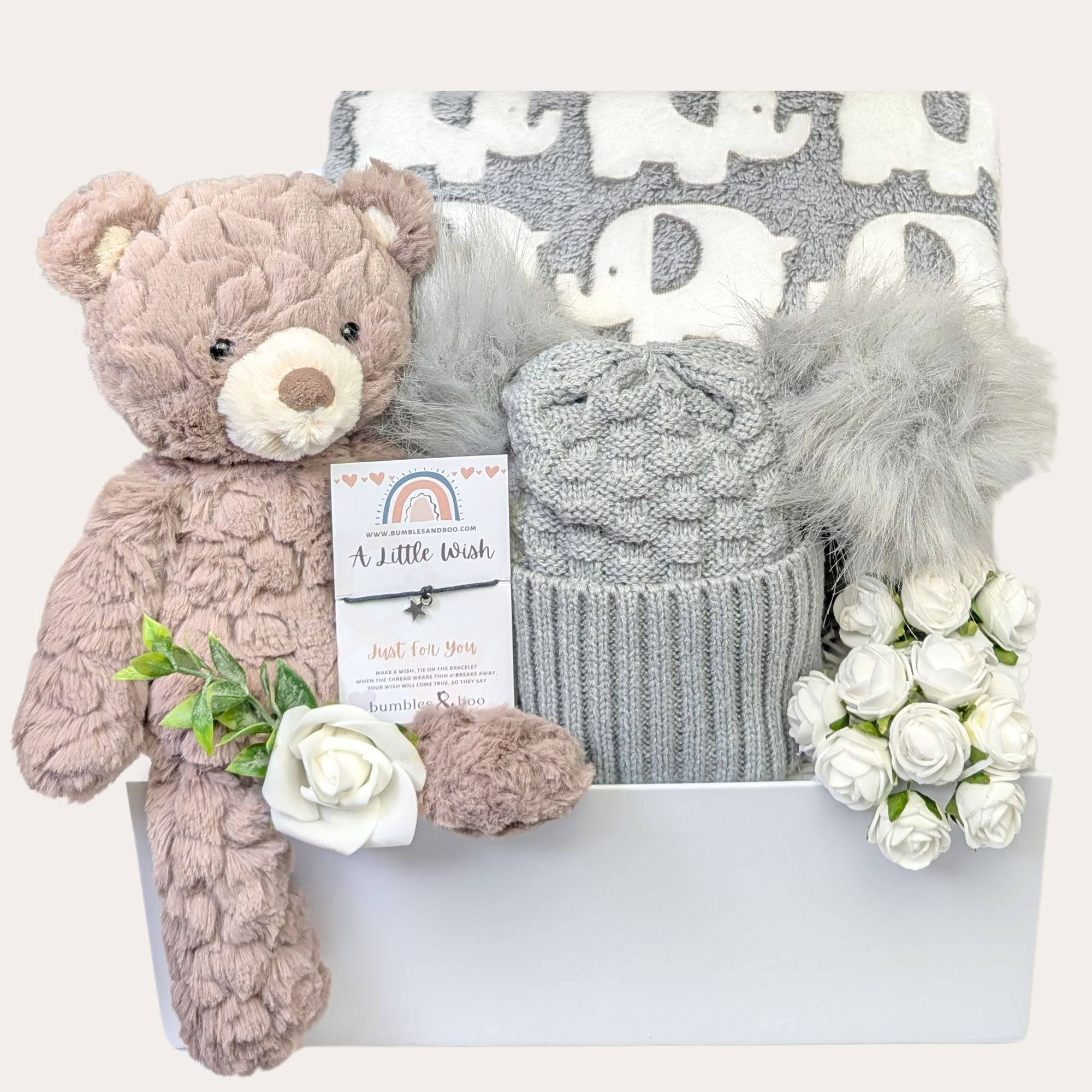 Baby shower gifts box with teddy bear, grey pompom hat and elephant blanket. Hamper design by Bumbles and Boo.