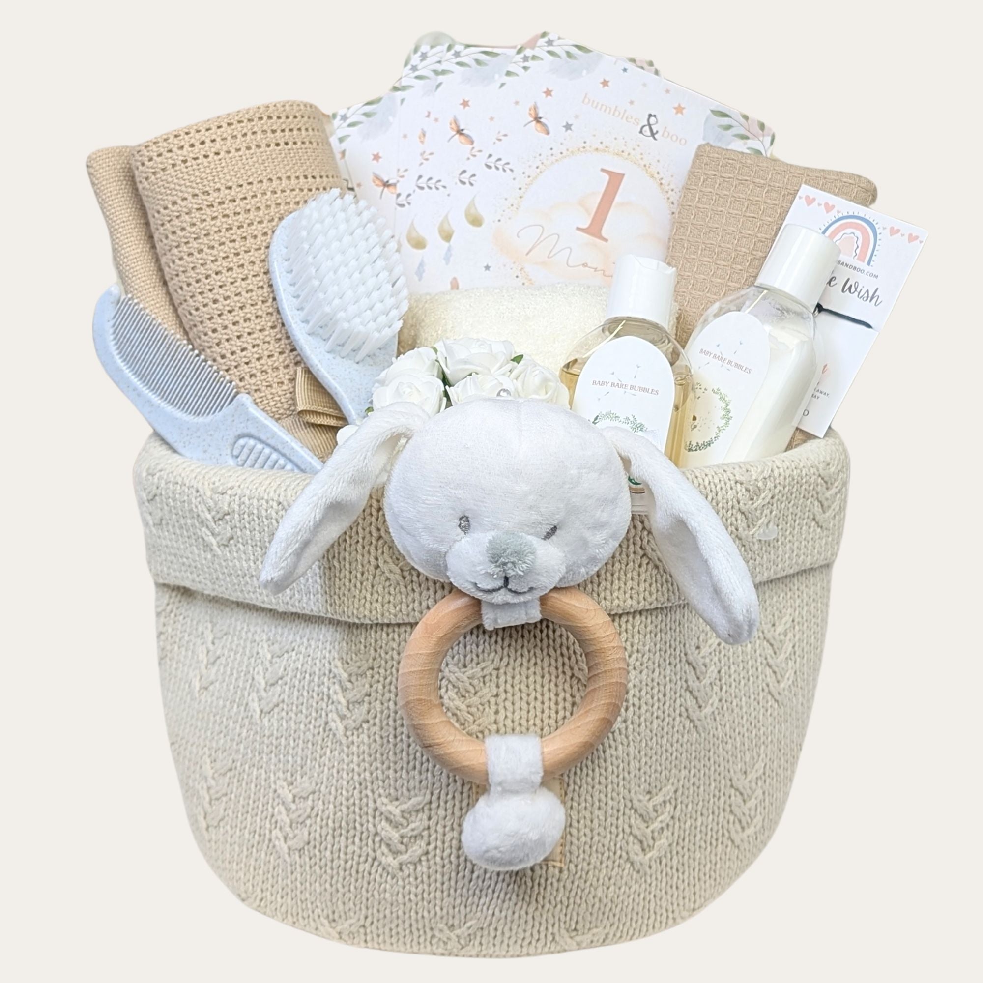 baby shower gift hamper with blanket, brush and comb, organic skincare and a baby teething toy. Bumbles and Boo.