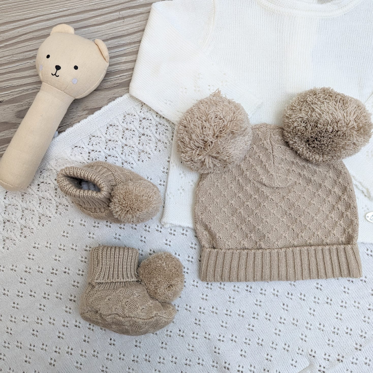 Biscuit coloured knitted double pompom hat and pompom booties