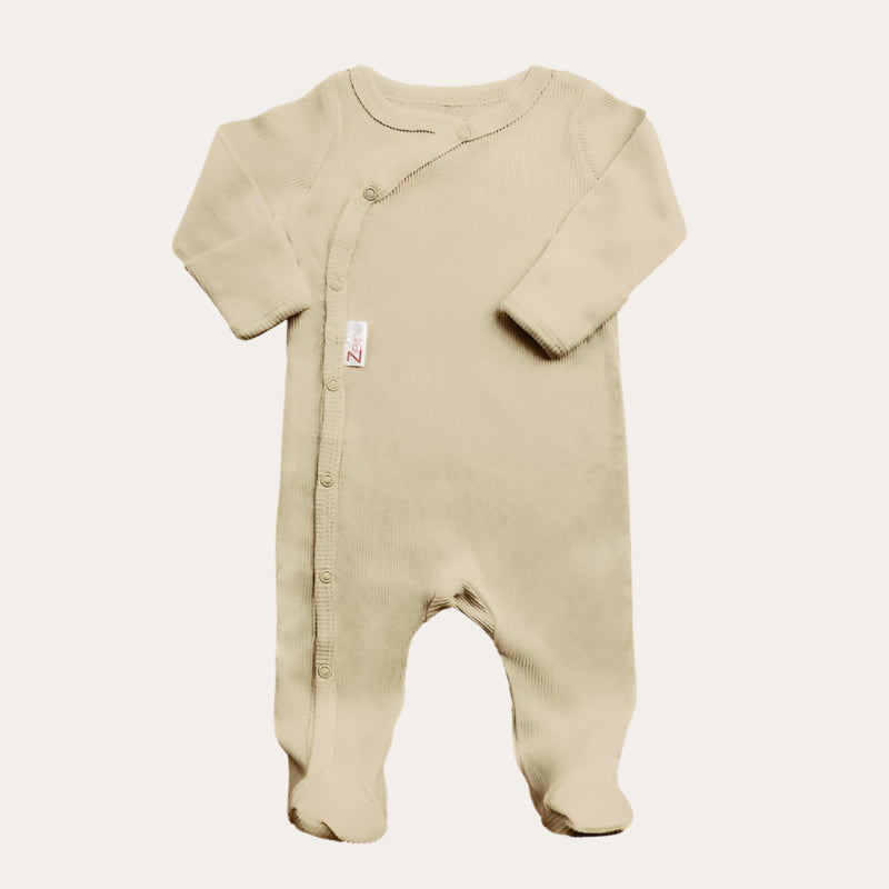 biscuit ribbed sleepsuit displayed flat, showing front and leg poppers