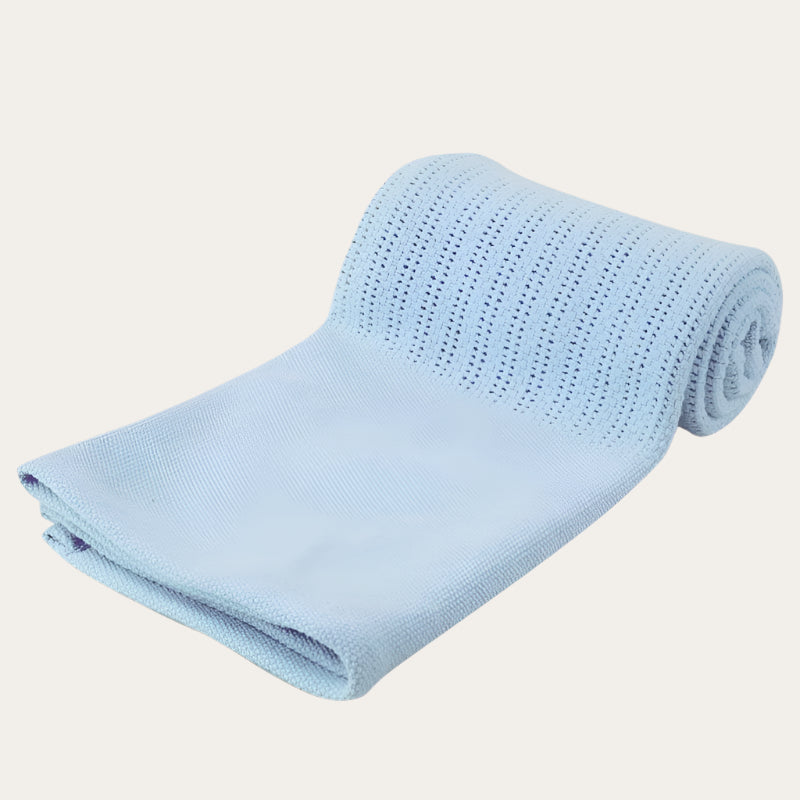 Personalisable blue  Cotton Cellular Blanket in use, covering a sleeping baby.